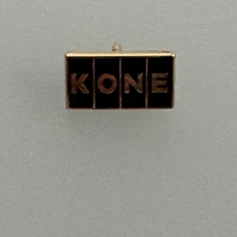 10k Gold KONE  Black and Gold Pin